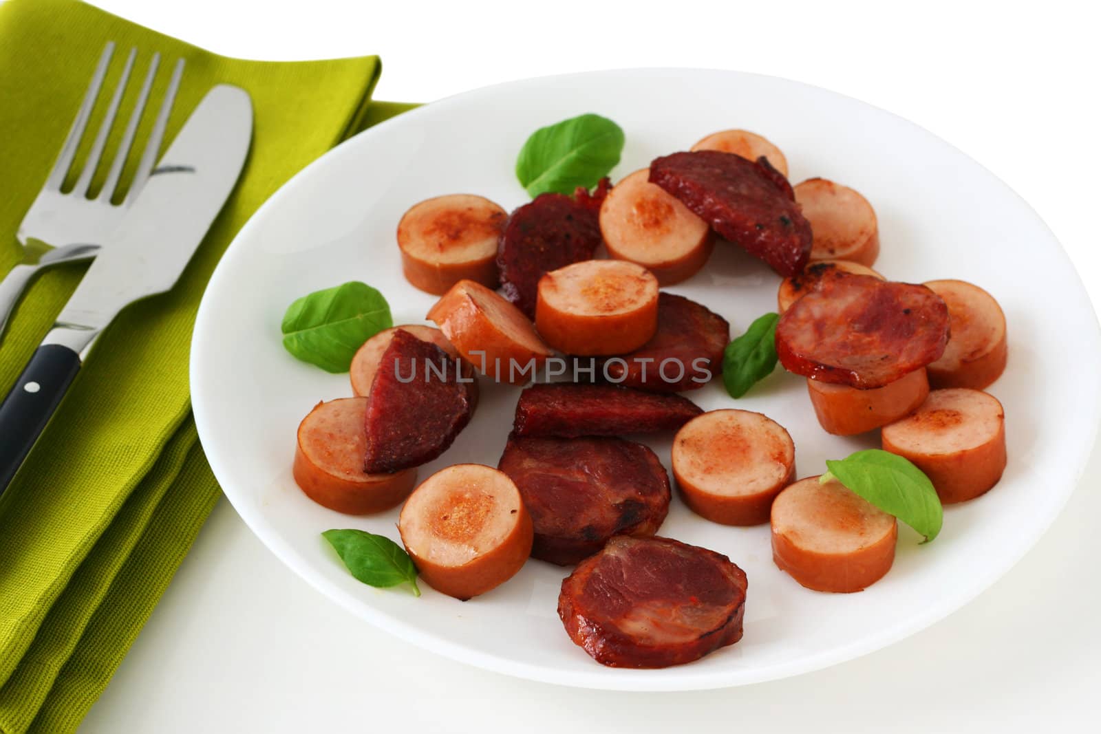 Cut fried sausages on a plate