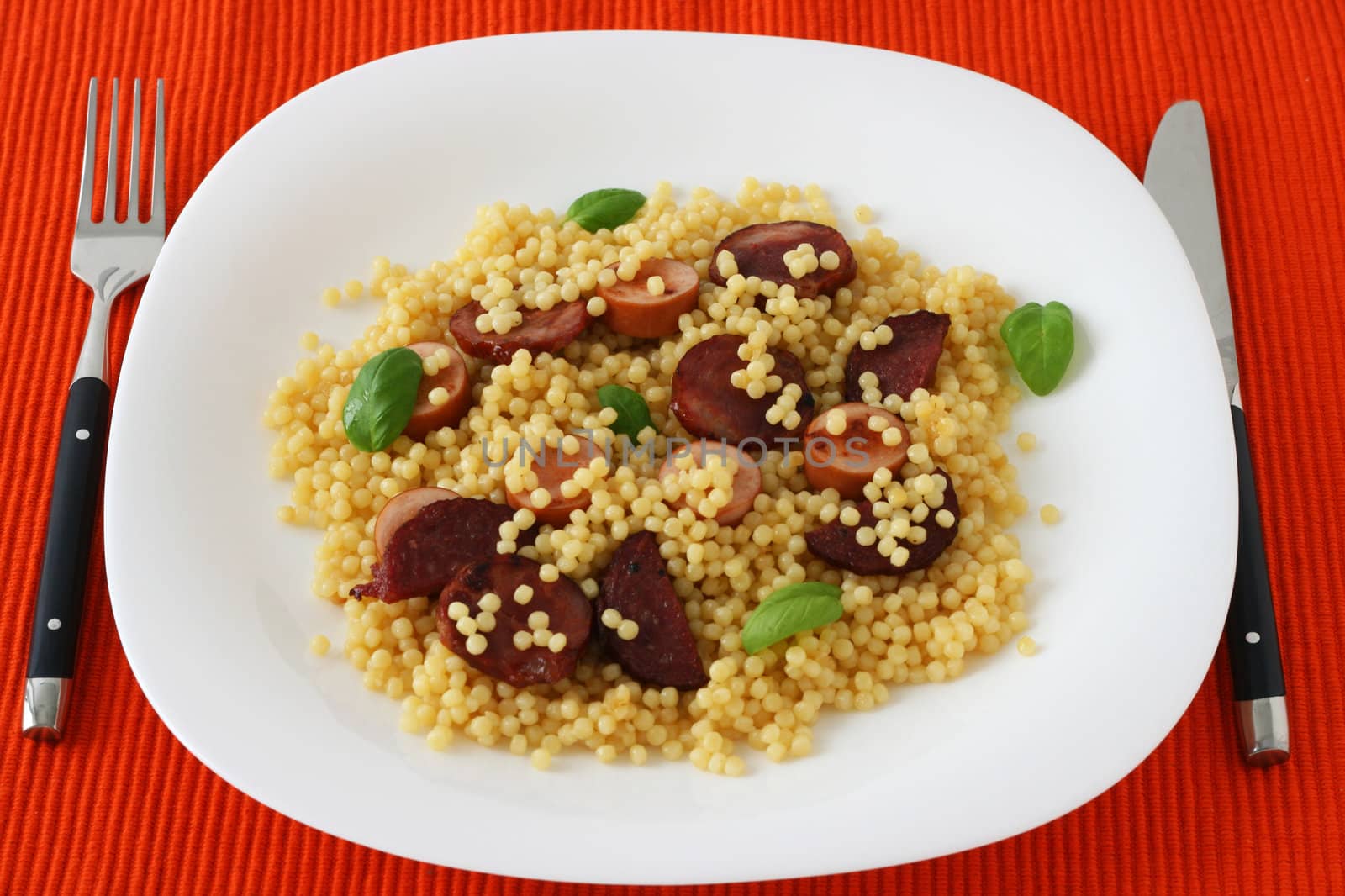 Couscous with fried sausages