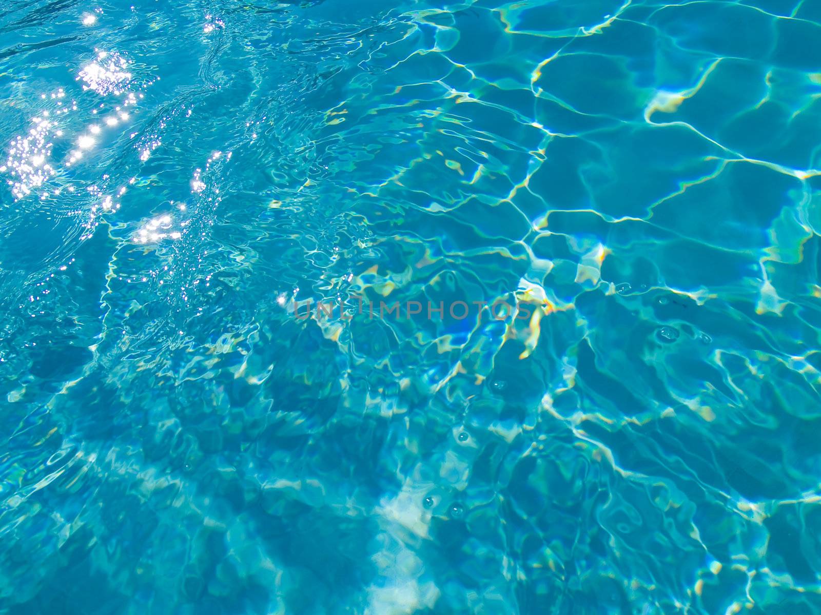 Blue Swimming Pool Water in Full Sunlight