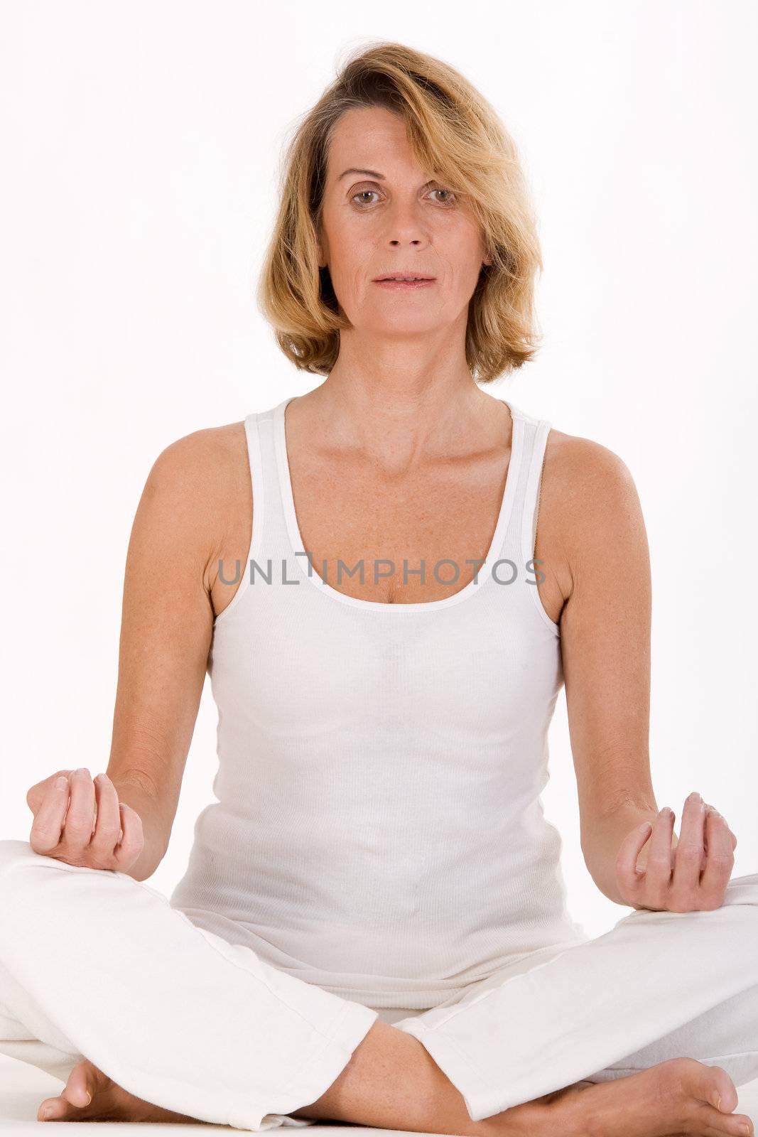Older lady finds relaxation in yoga