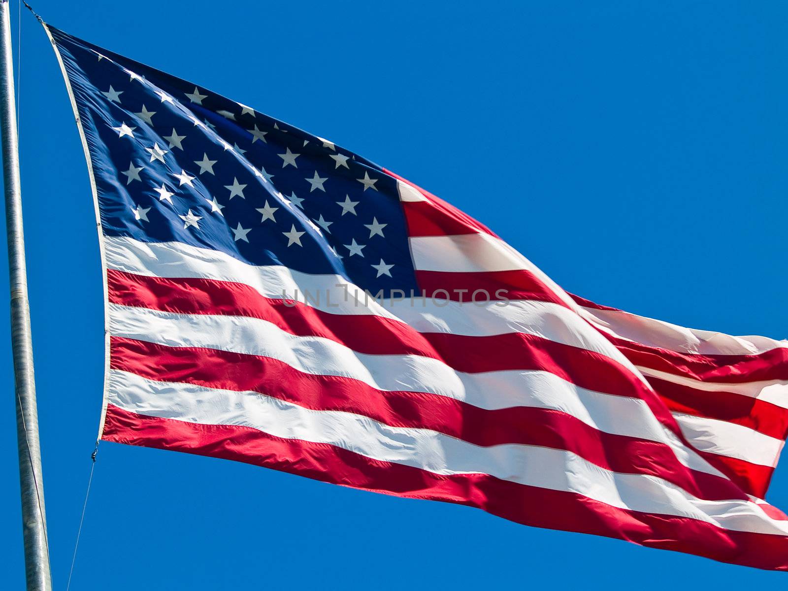 American Flag Waving Proudly on a Clear Windy Day