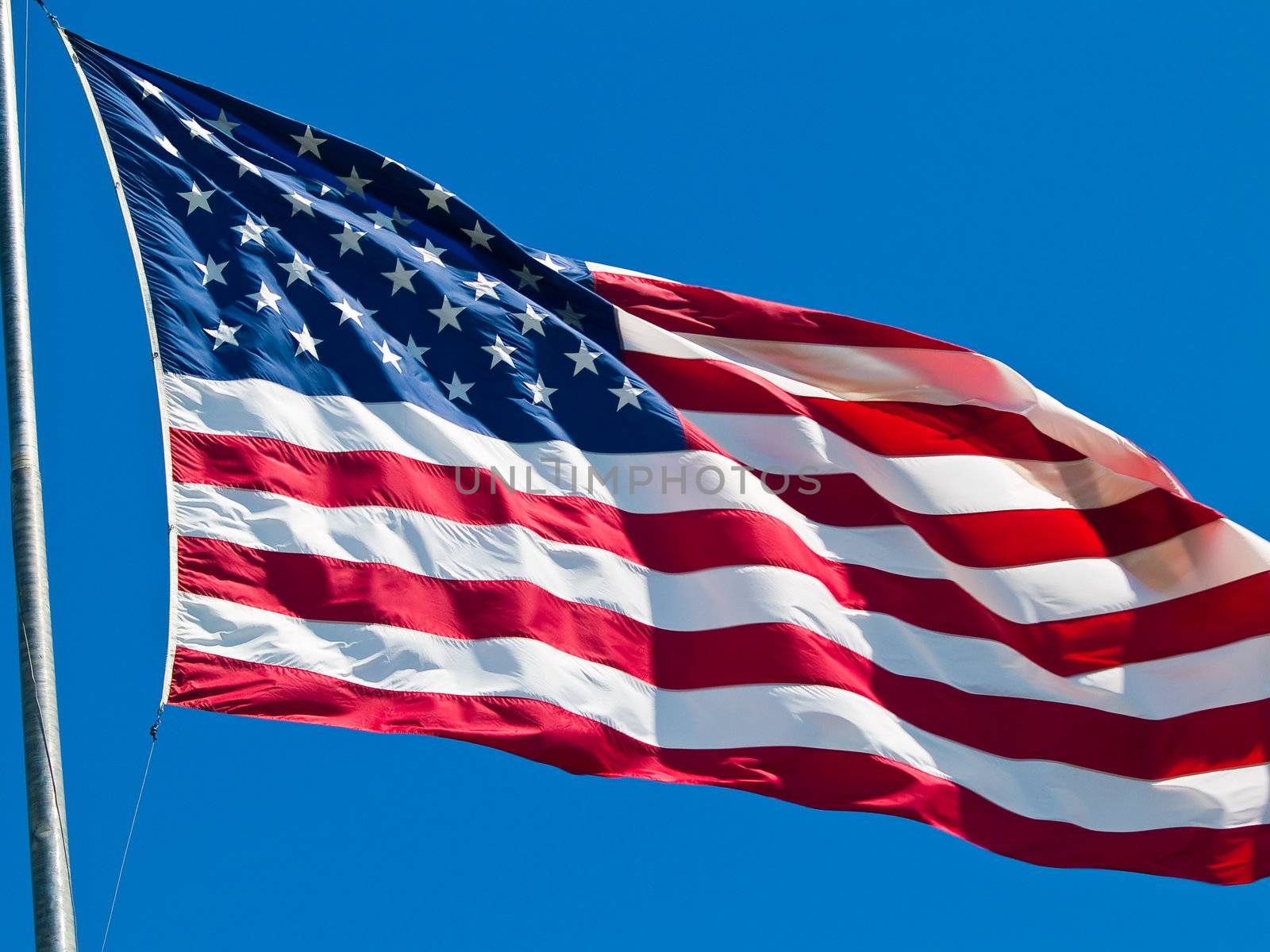 American Flag Waving Proudly on a Clear Windy Day