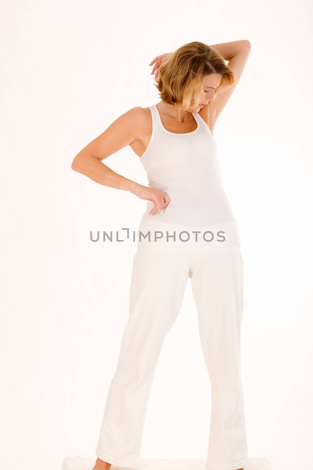 Elderly lady in a yoga exercise in standing