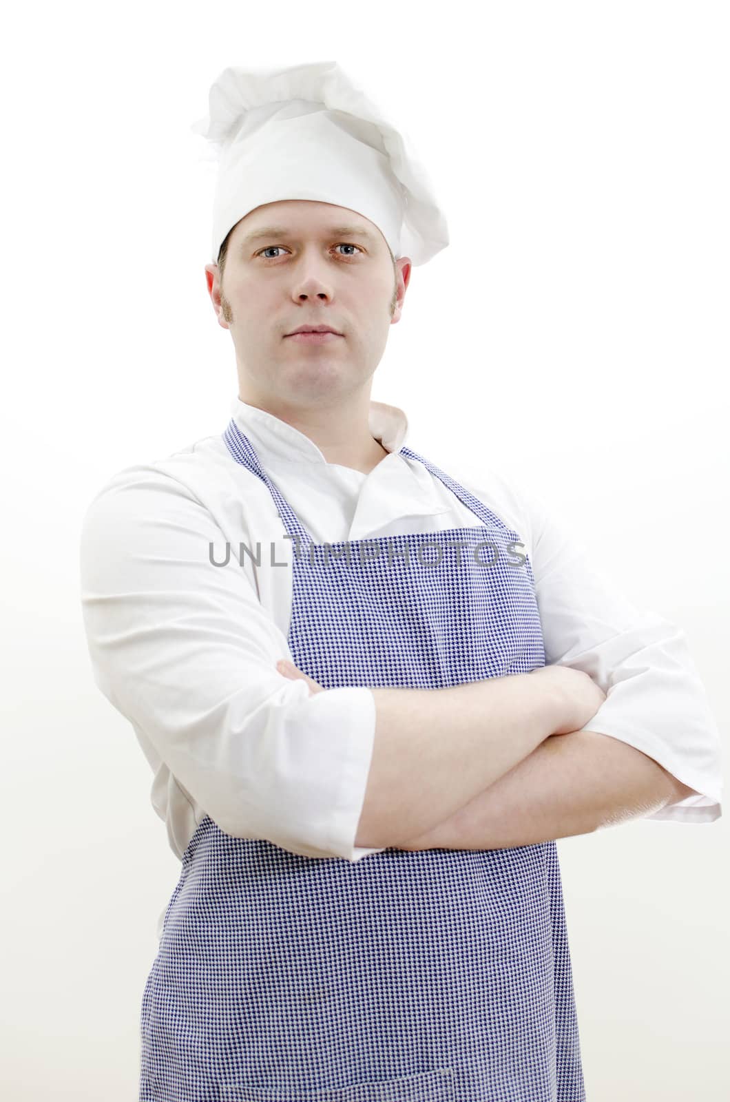 Portrait of handsome chief cook with arms crossed