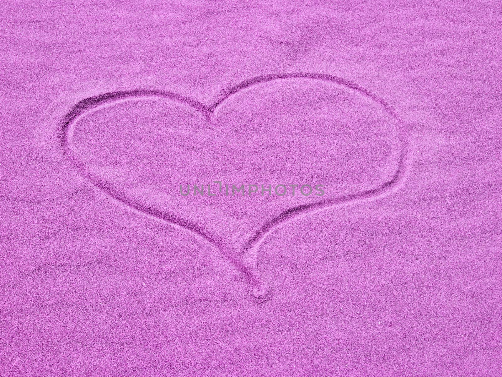 Purple Heart in the Sand on a Sunny Day