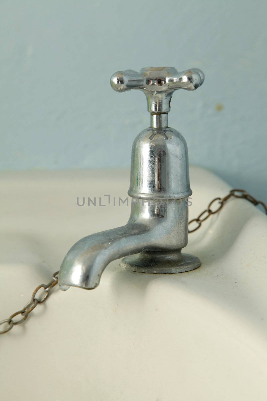 Old silver faucet by haiderazim