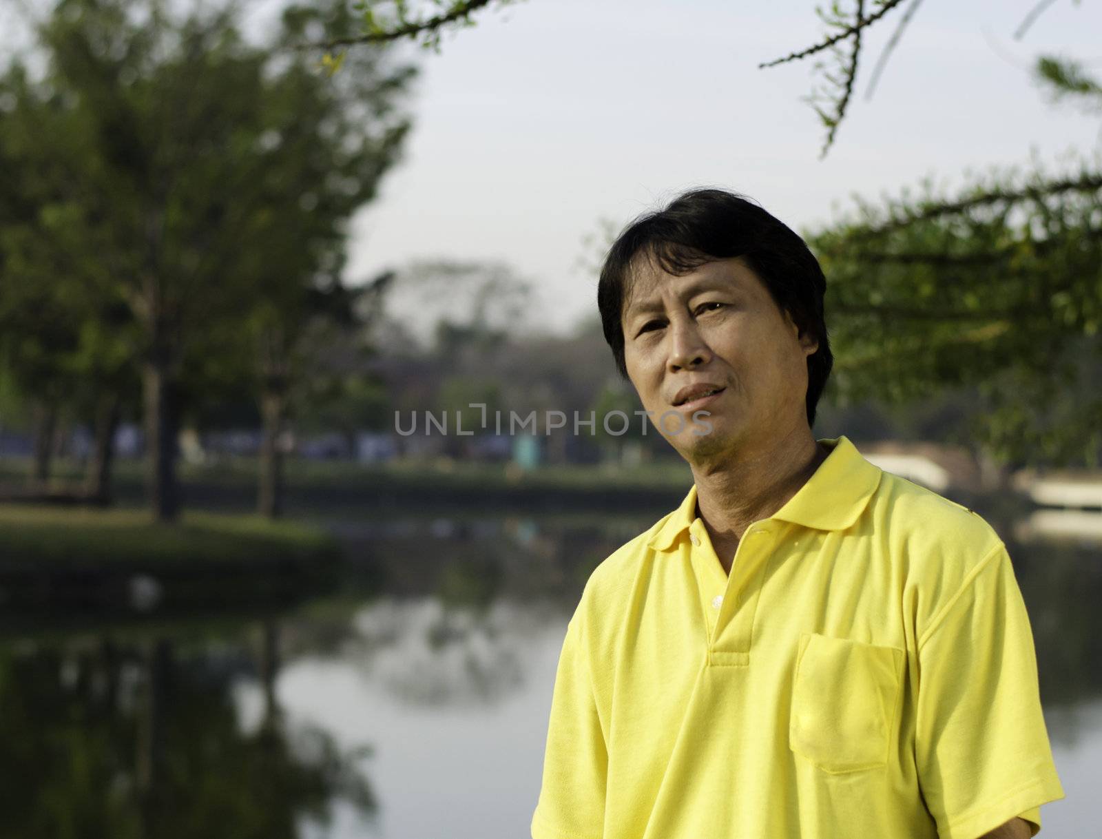 portrait of a happy man thailand park  by siraanamwong
