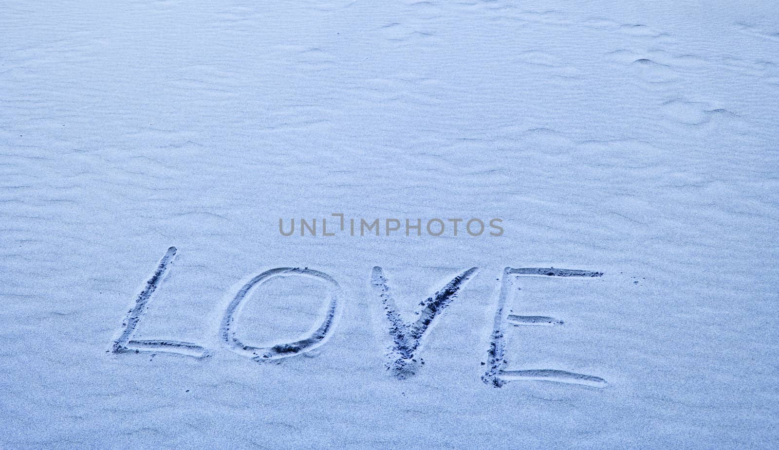 Love Written in Blue Sand on a Sunny Day