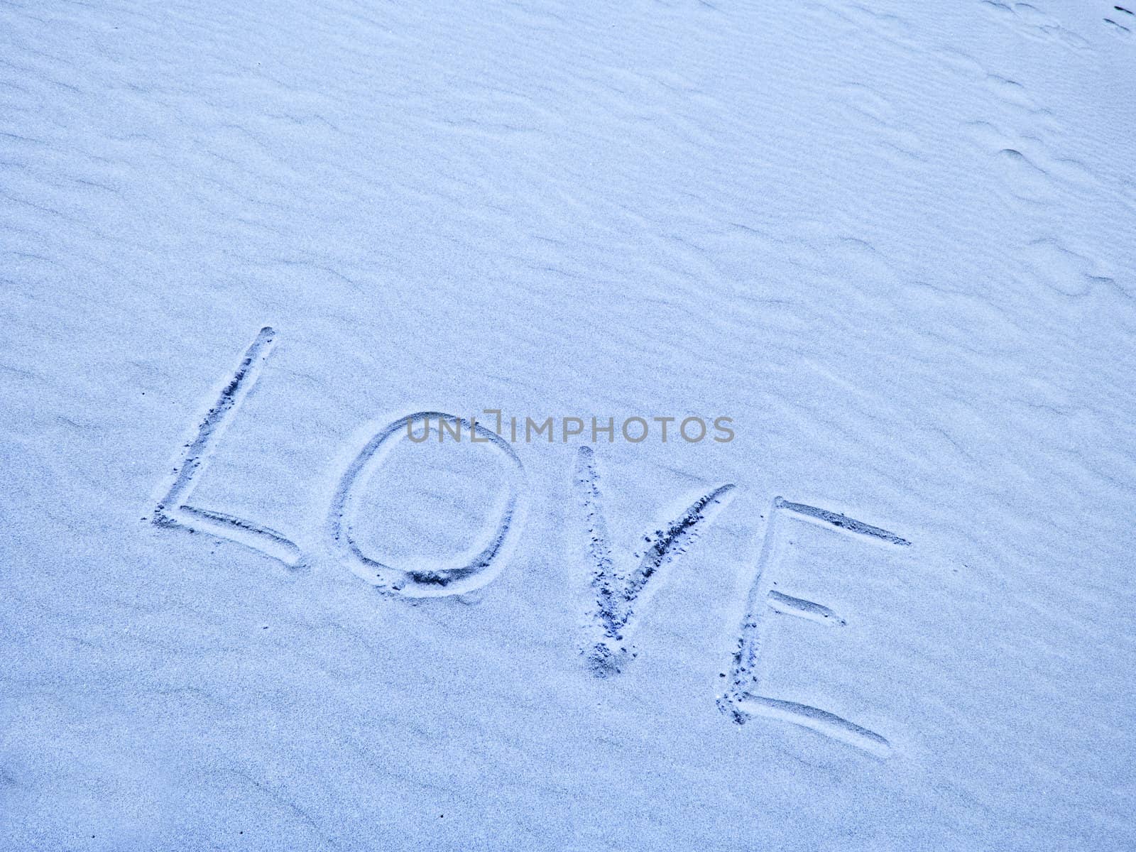 Love Written in Blue Sand on a Sunny Day