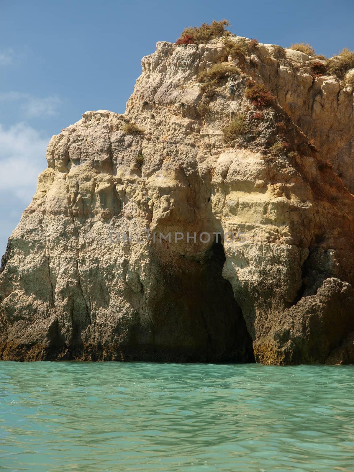 Caves and colourful rock formations on the Algarve coast in Portugal
