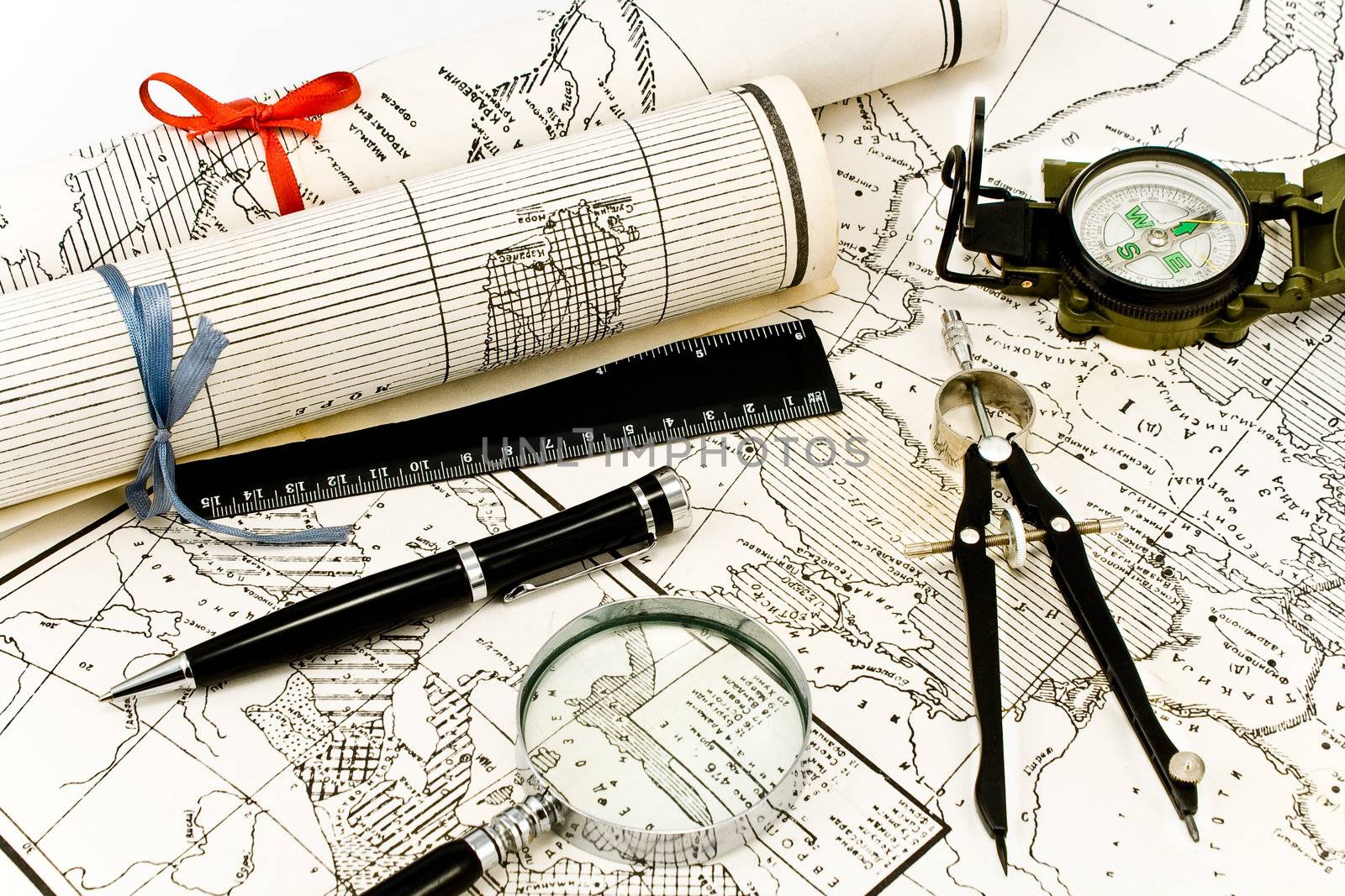 Old Maps in rolls with tools for navigation