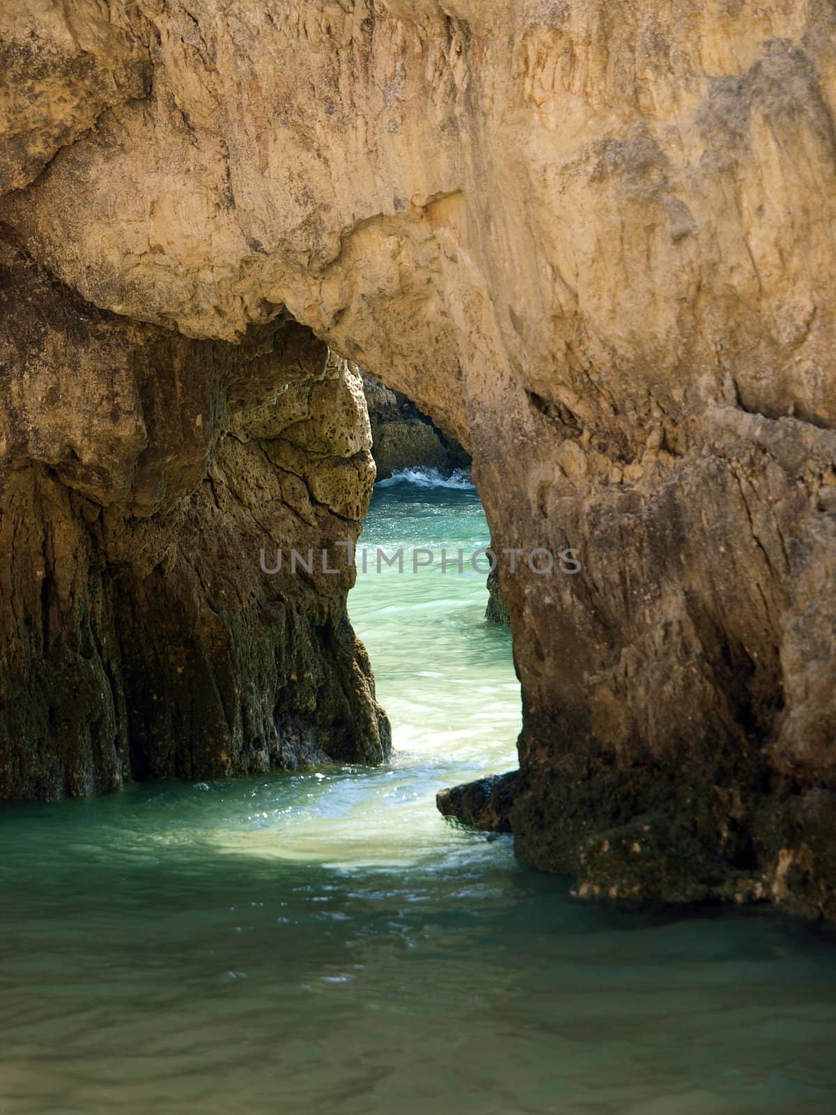 Caves and colourful rock formations on the Algarve coast in Portugal