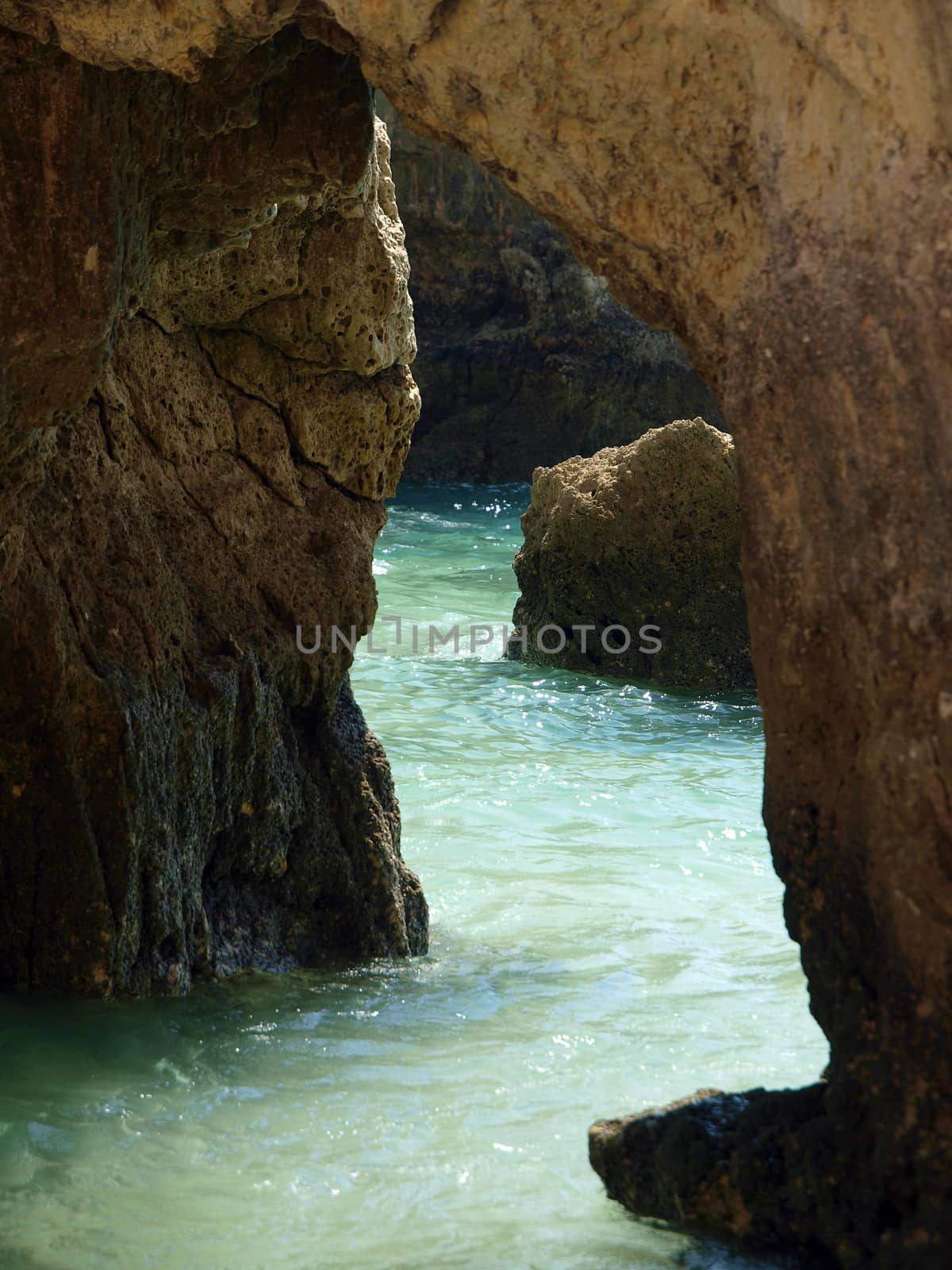 Caves and colourful rock formations on the Algarve coast in Portugal