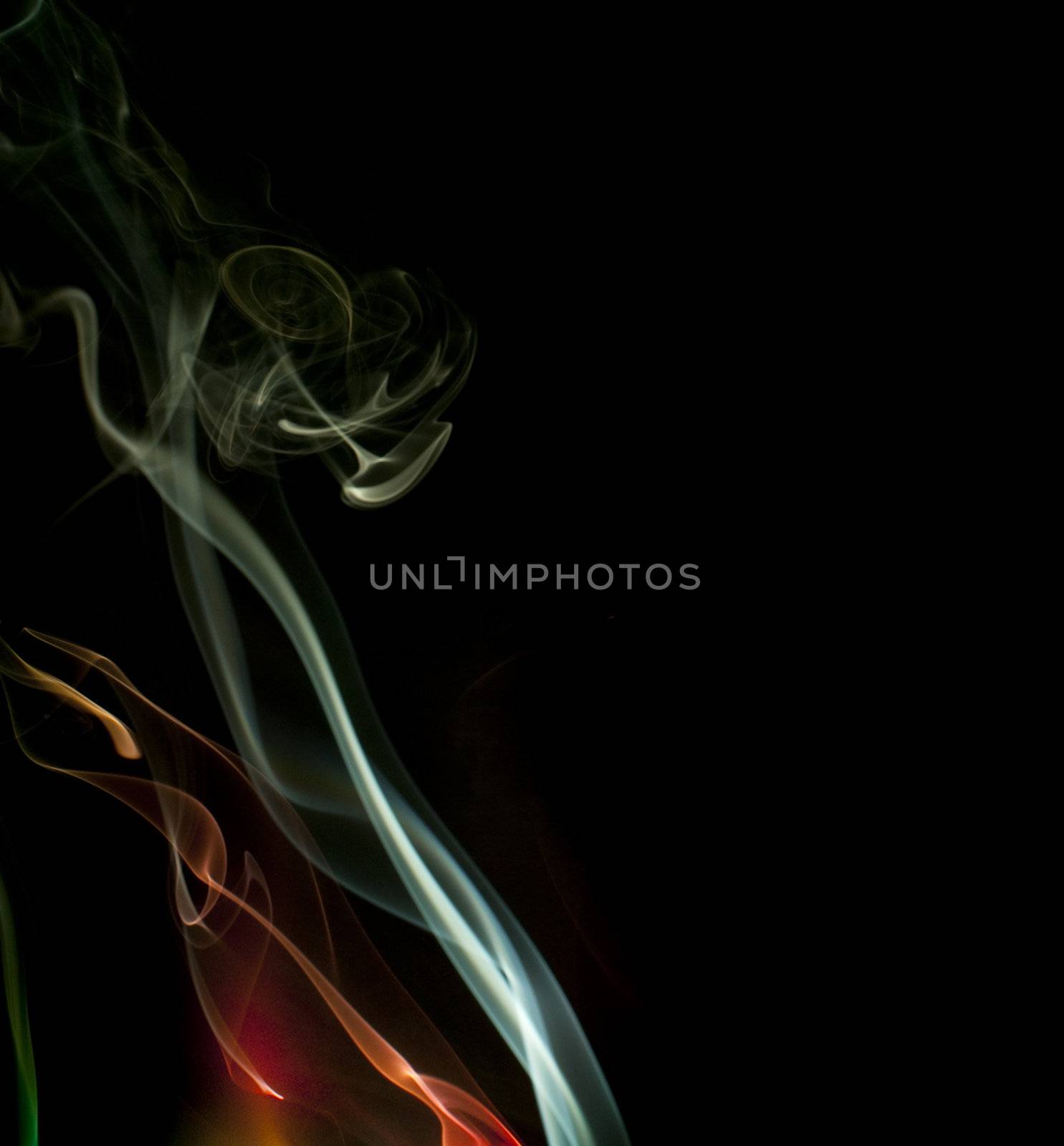 colorful background of smoke trails lit by colored lights