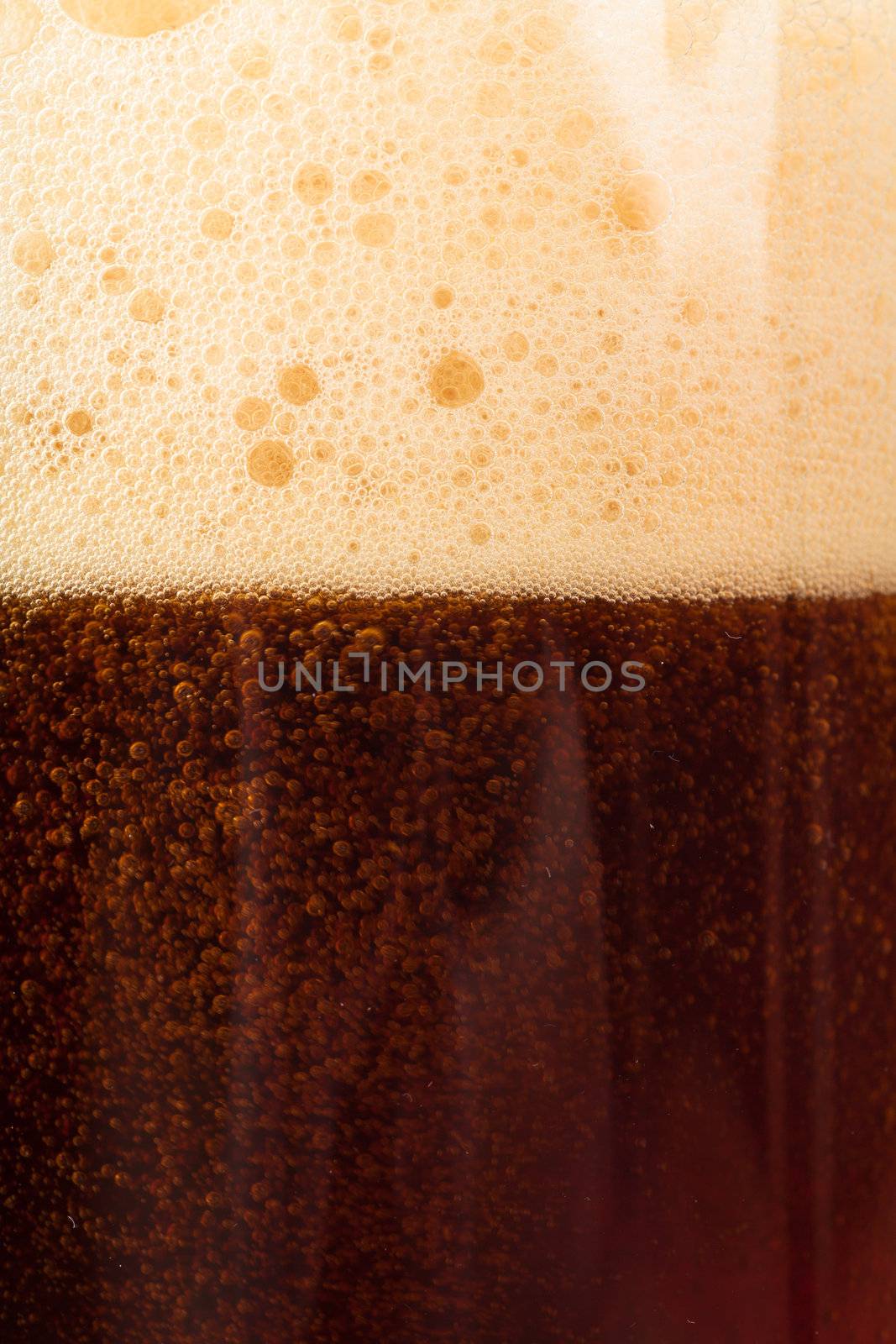 Closeup view of dark beer in the glass