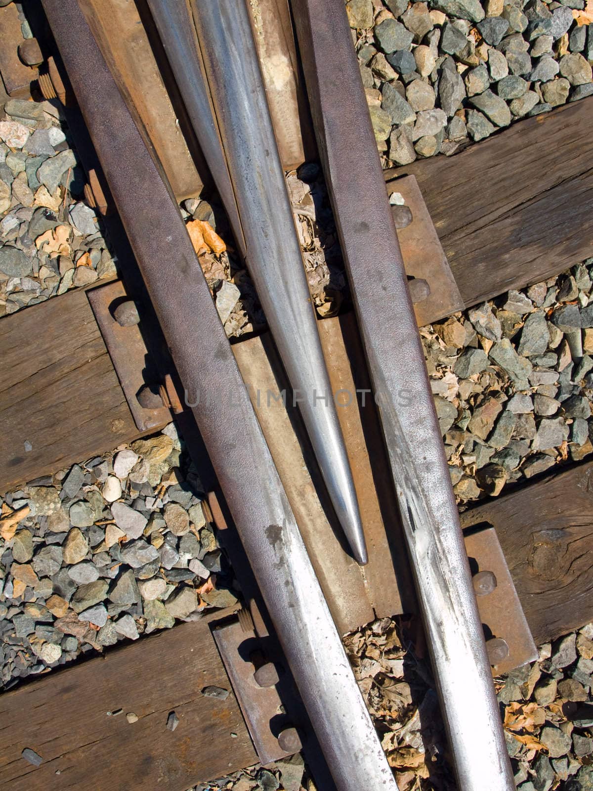 Closeup of an Old Railroad Tracks at a Junction on a Sunny Day