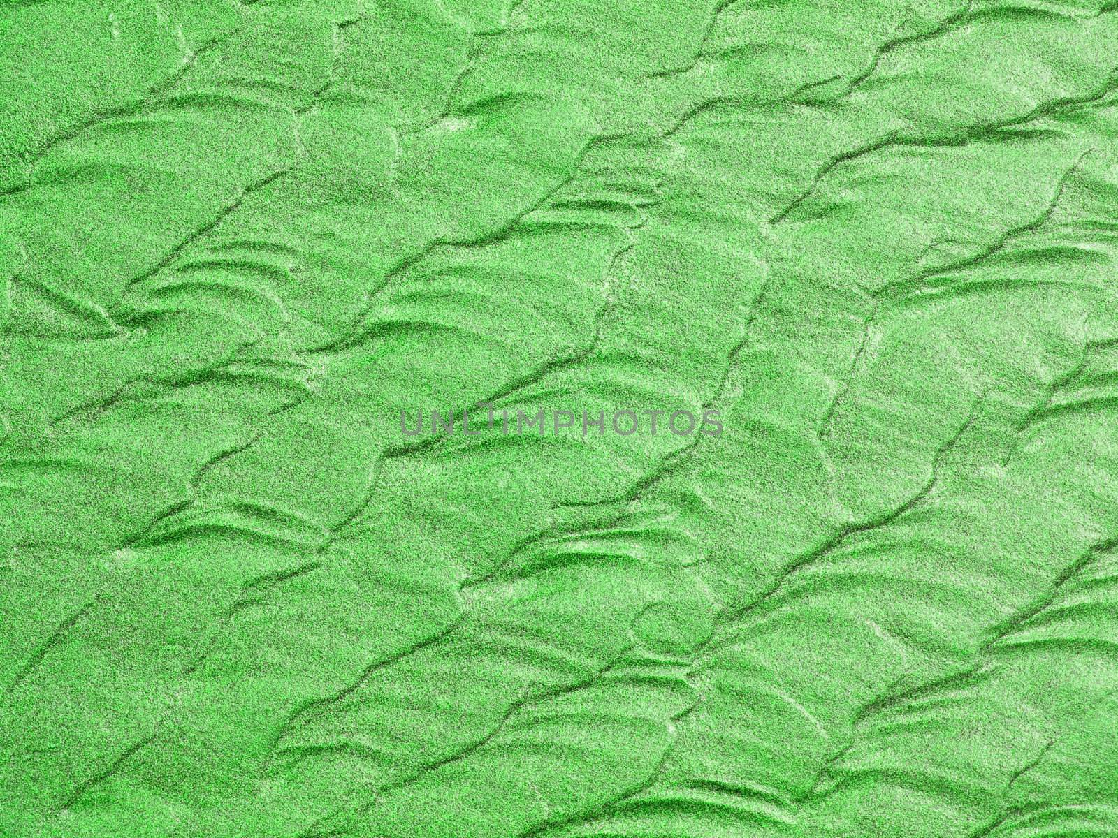 Abstract background of green sand ripples at the beach 