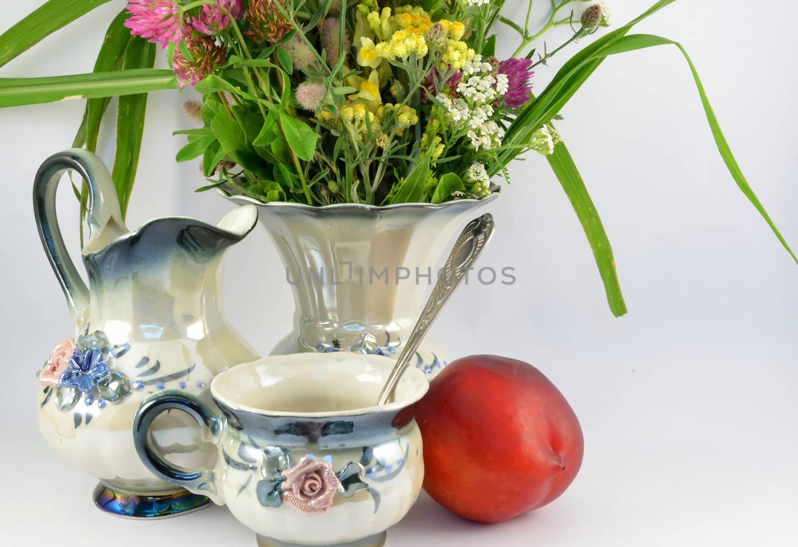 Vase of summer flowers and peach