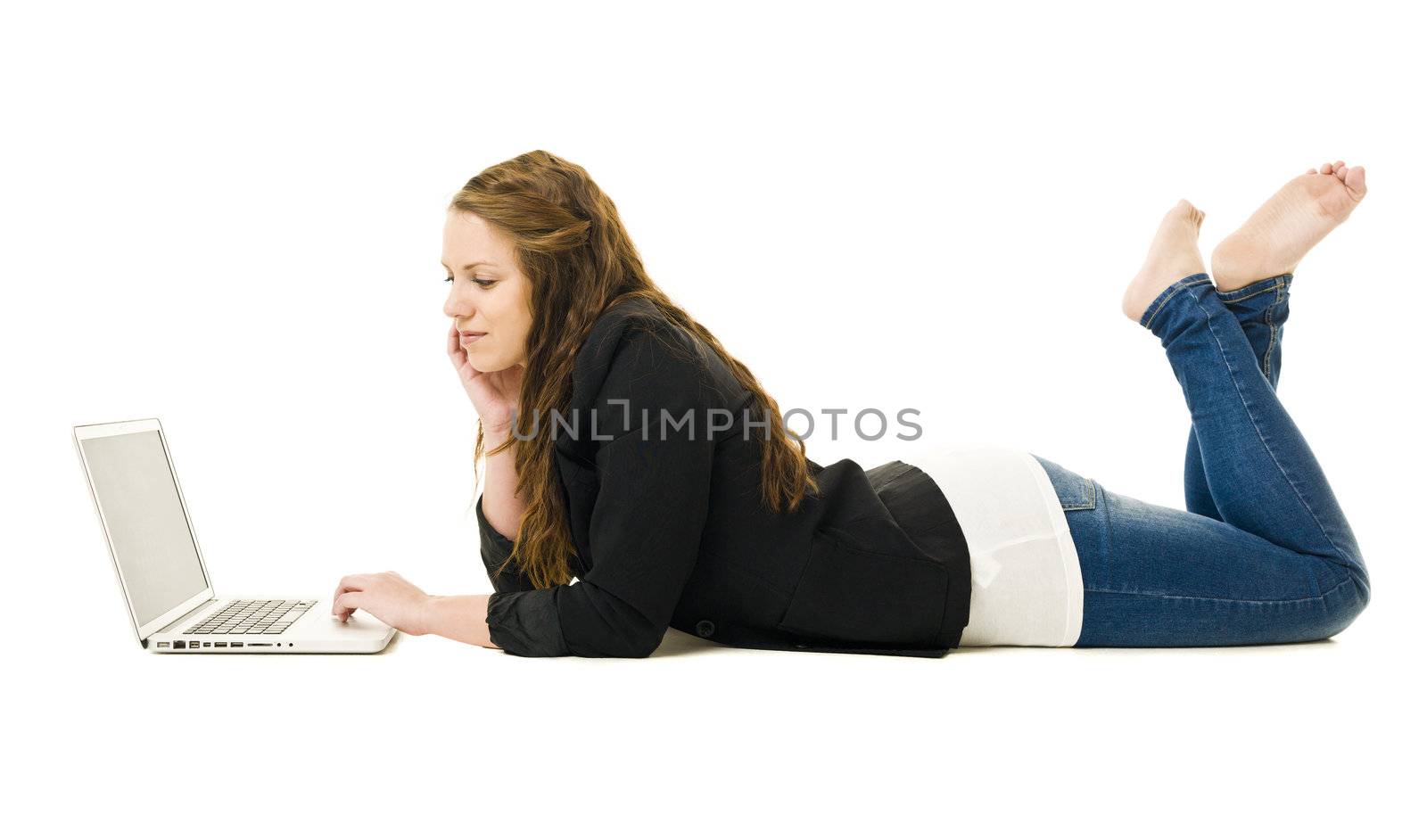 Woman on the floor with a laptop isolated