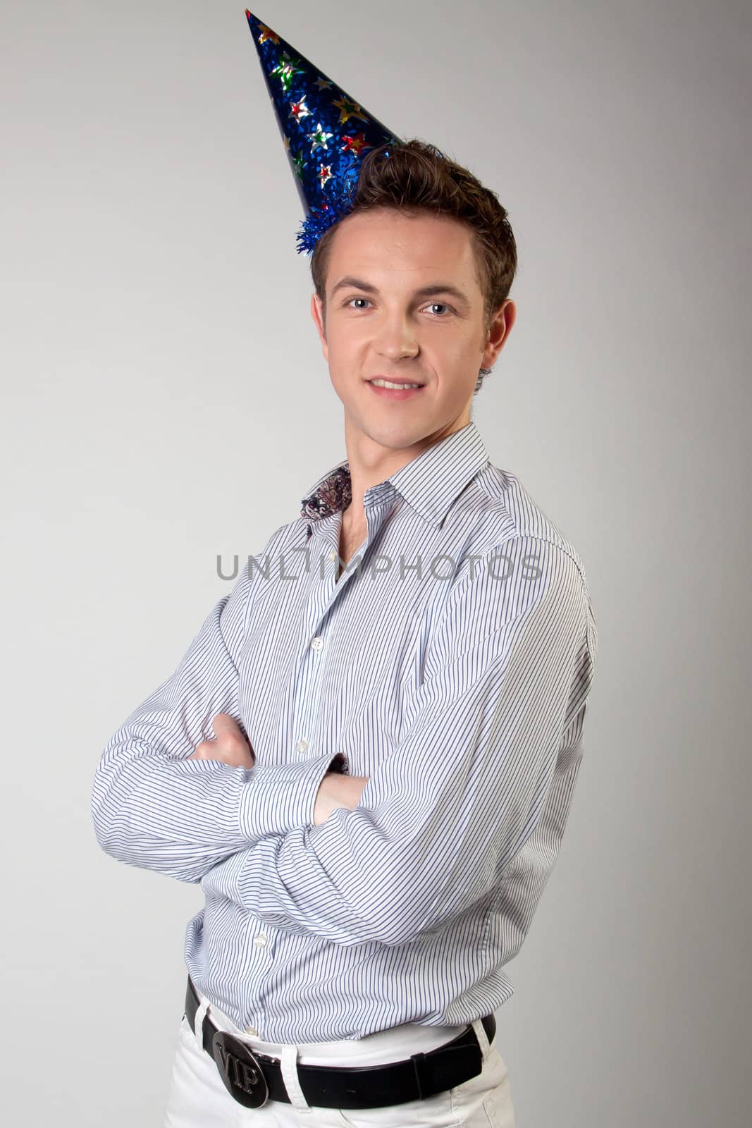 Portrait of a young man in formal attire with a New Year's gifts in their hands