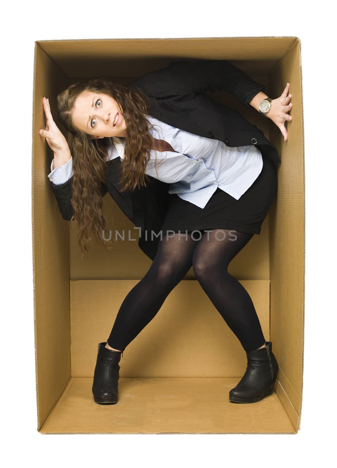 Young Woman inside of a tight Cardboard Box