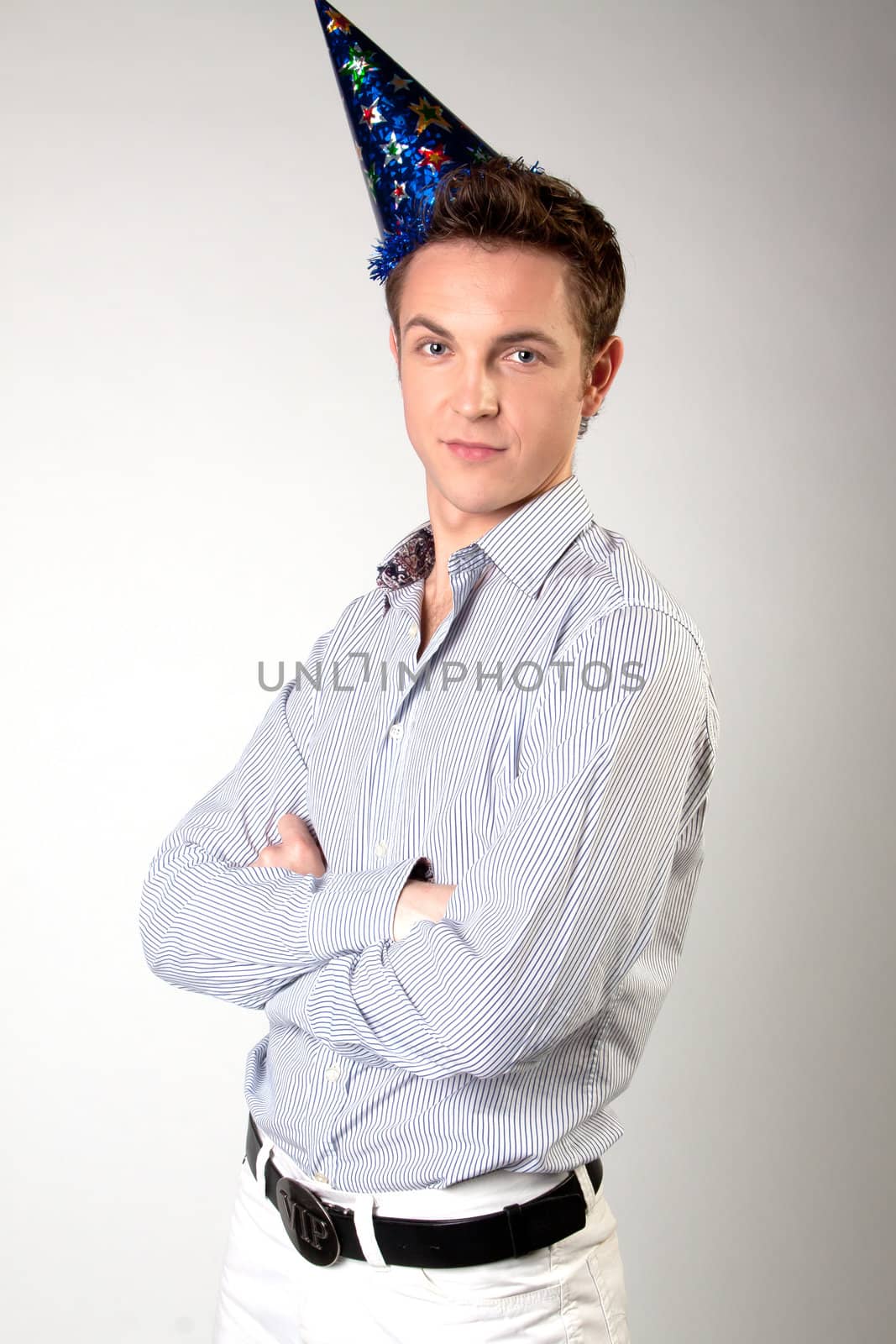Portrait of a young man in formal attire with a New Year's gifts in their hands