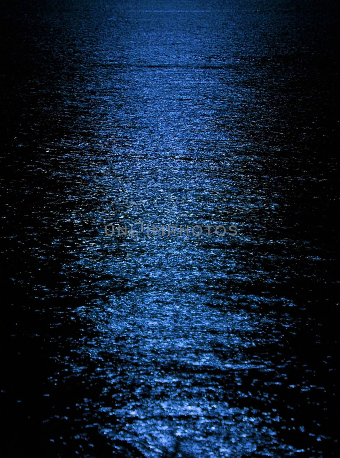 Moon light reflection on calm but rippled water