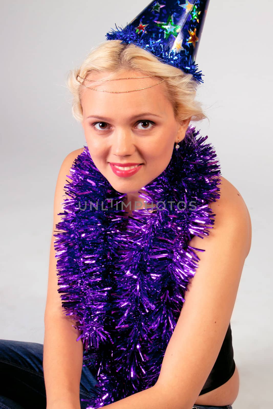 Young and beautiful girl with gifts waiting for the Christmas and New Year
