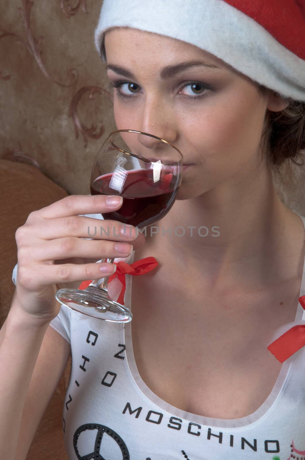 Young and beautiful girl with gifts waiting for the Christmas and New Year