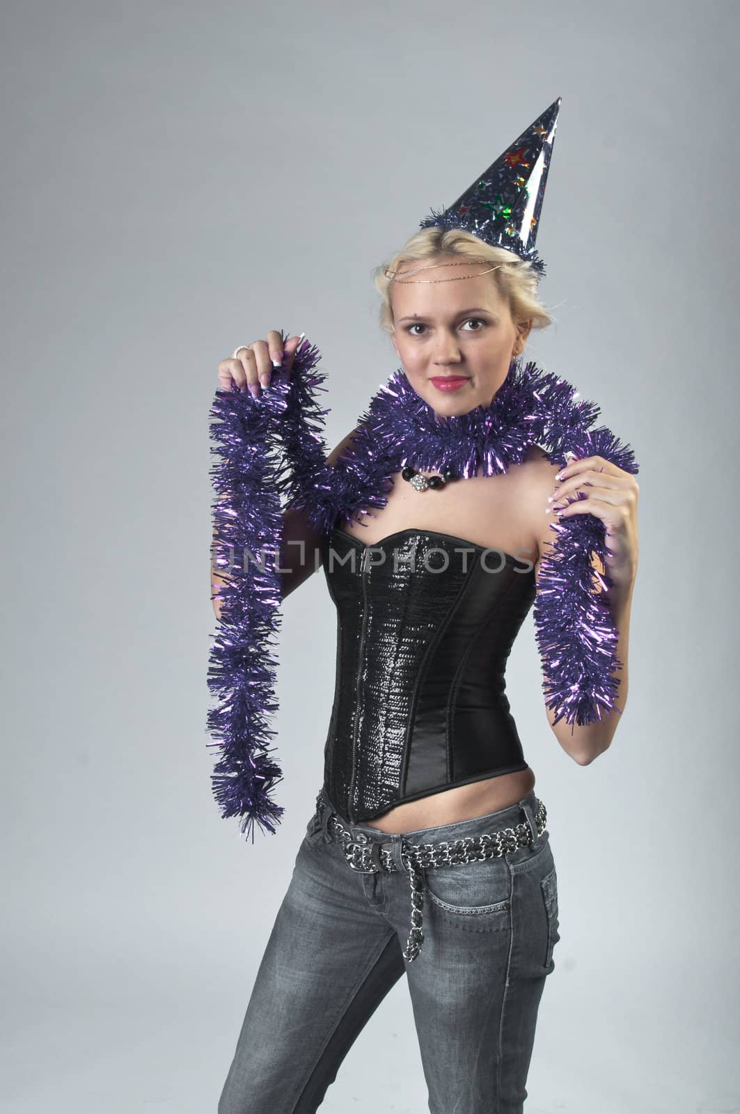 Young and beautiful girl with gifts waiting for the Christmas and New Year