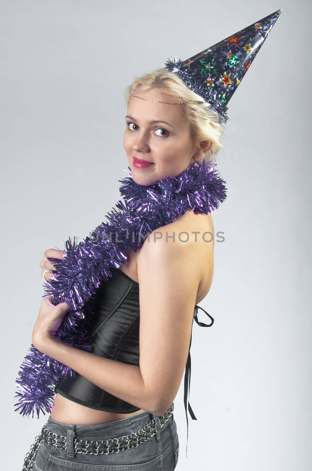 Young and beautiful girl with gifts waiting for the Christmas and New Year