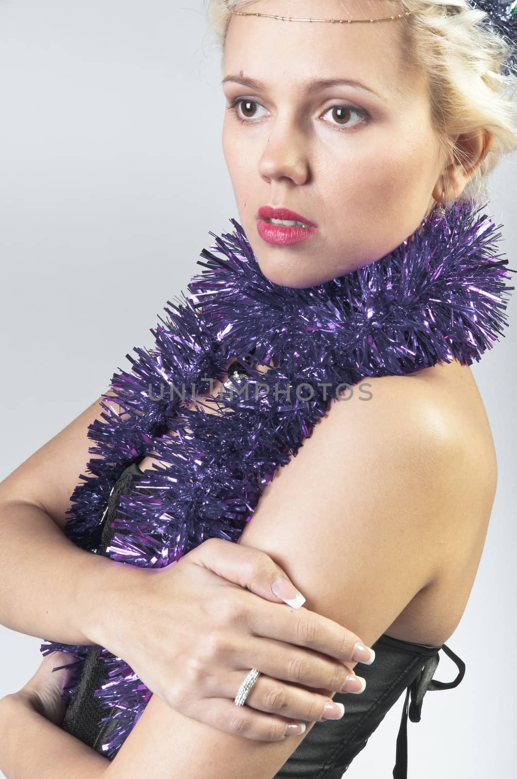 Young and beautiful girl with gifts waiting for the Christmas and New Year
