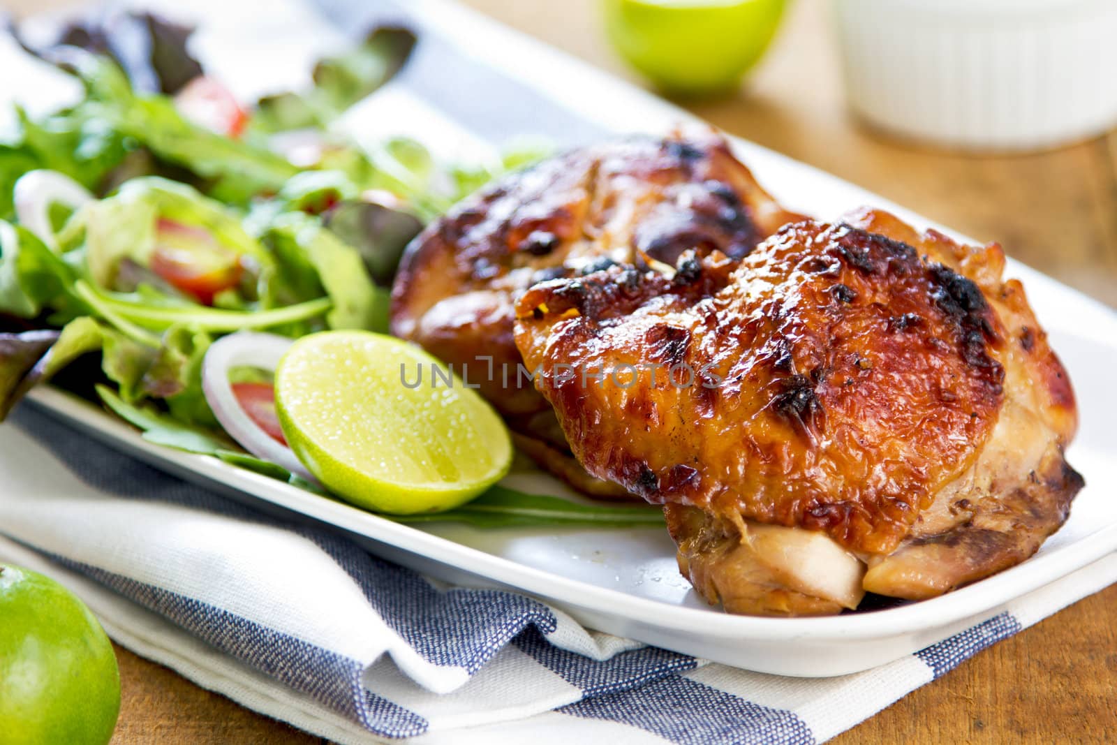 Grilled chicken with lettuce and rocket salad by sour cream dressing