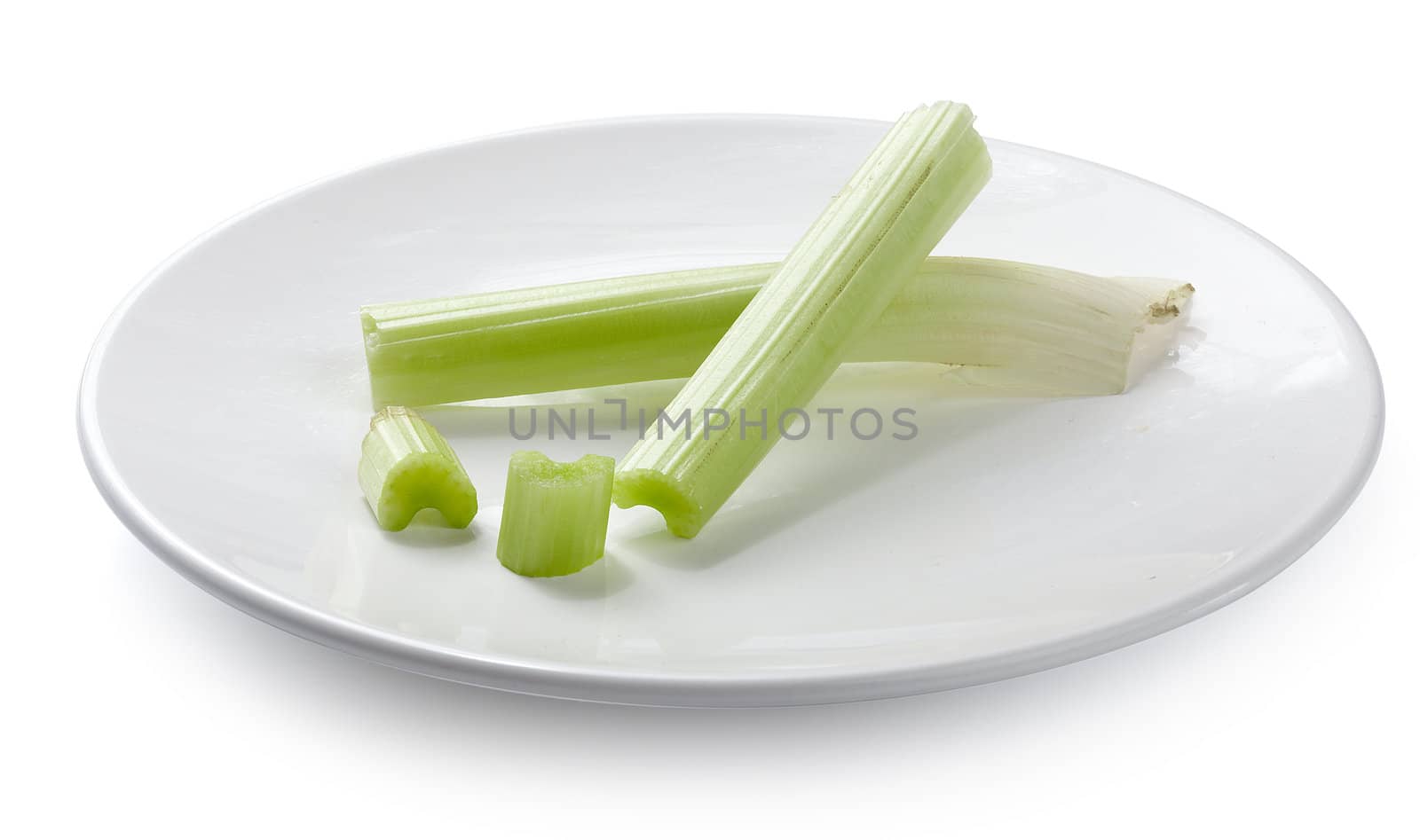 Two sticks of celery on the white plate