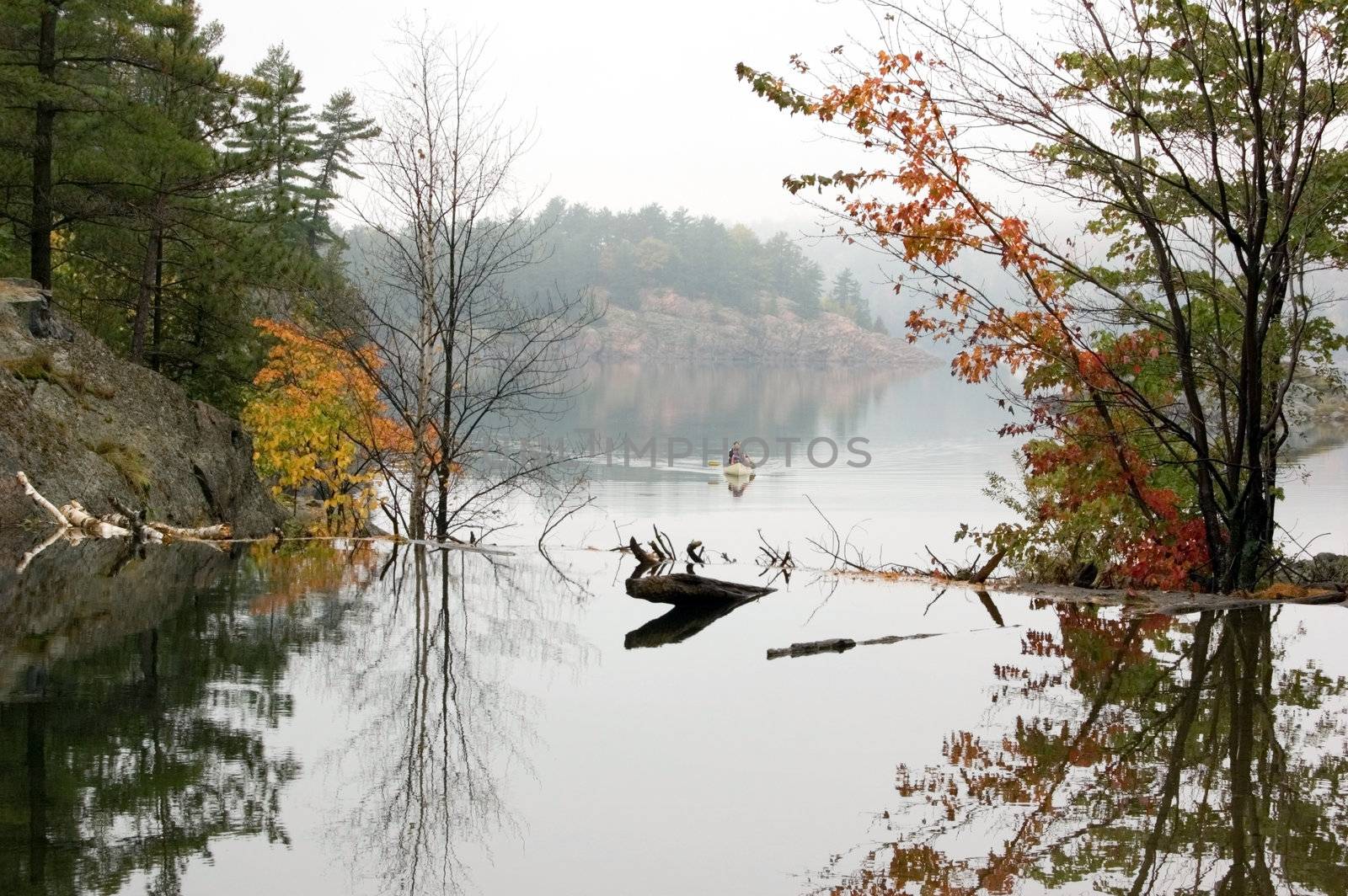 Canoing at George Lake in overcast day. Killarney Prov. Park