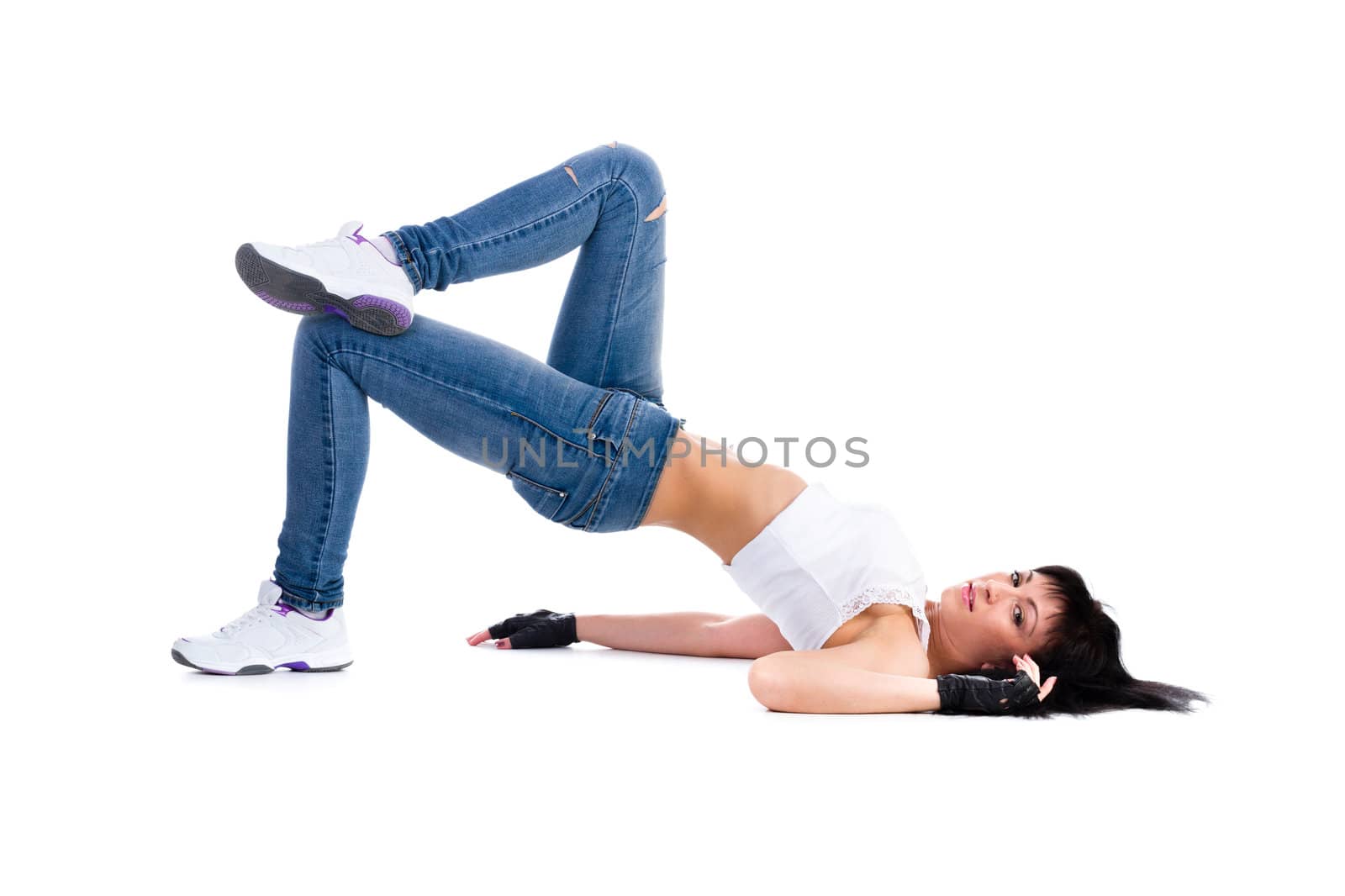 Young fitness woman doing exercise. Isolated on white background in full length.