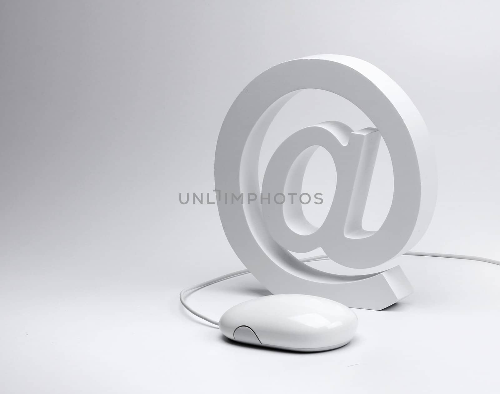 E-mail concept, @ sign email symbol and computer mouse