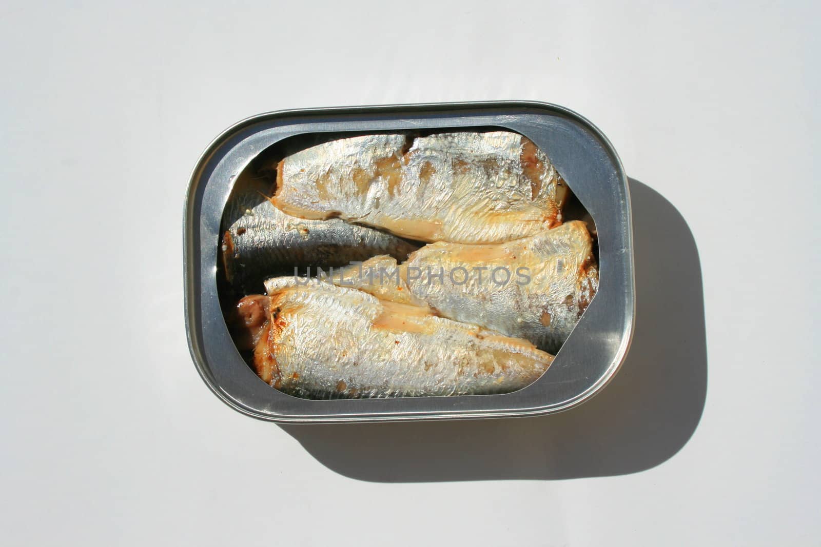Close up of sardines in a can.
