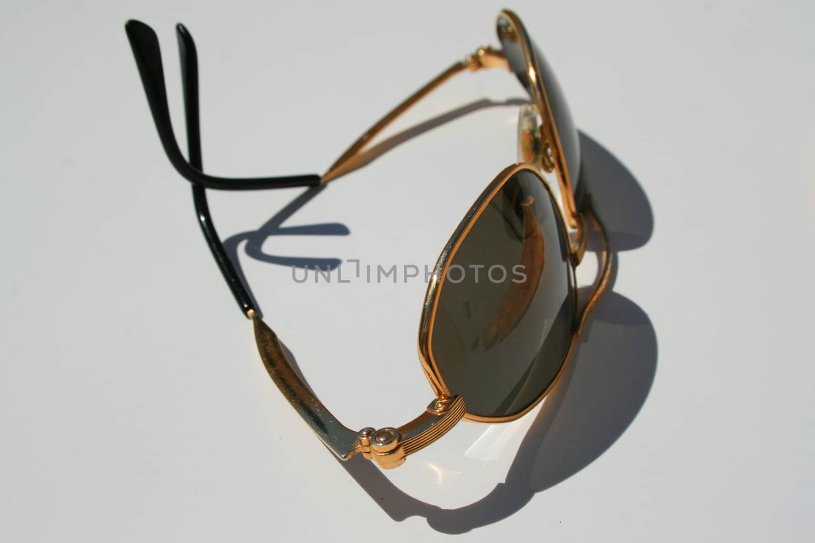 Close up of sunglasses on a white background.
