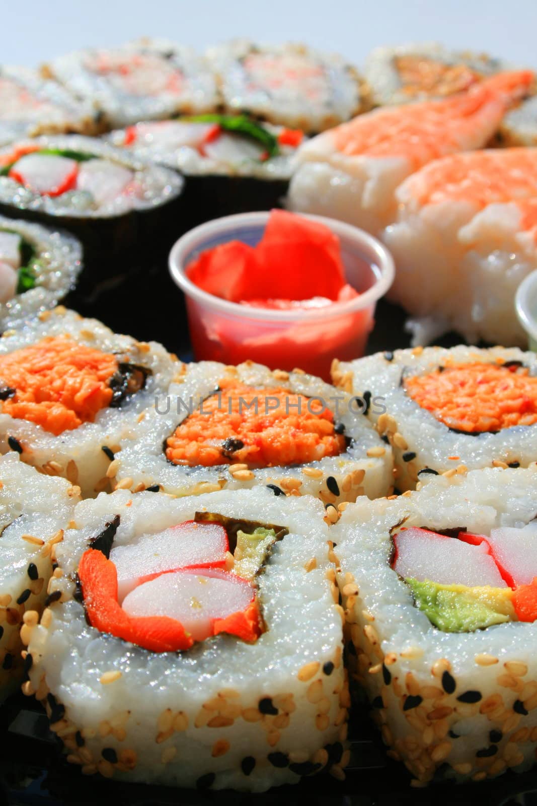 Close up of sushi assortment on a platter.
