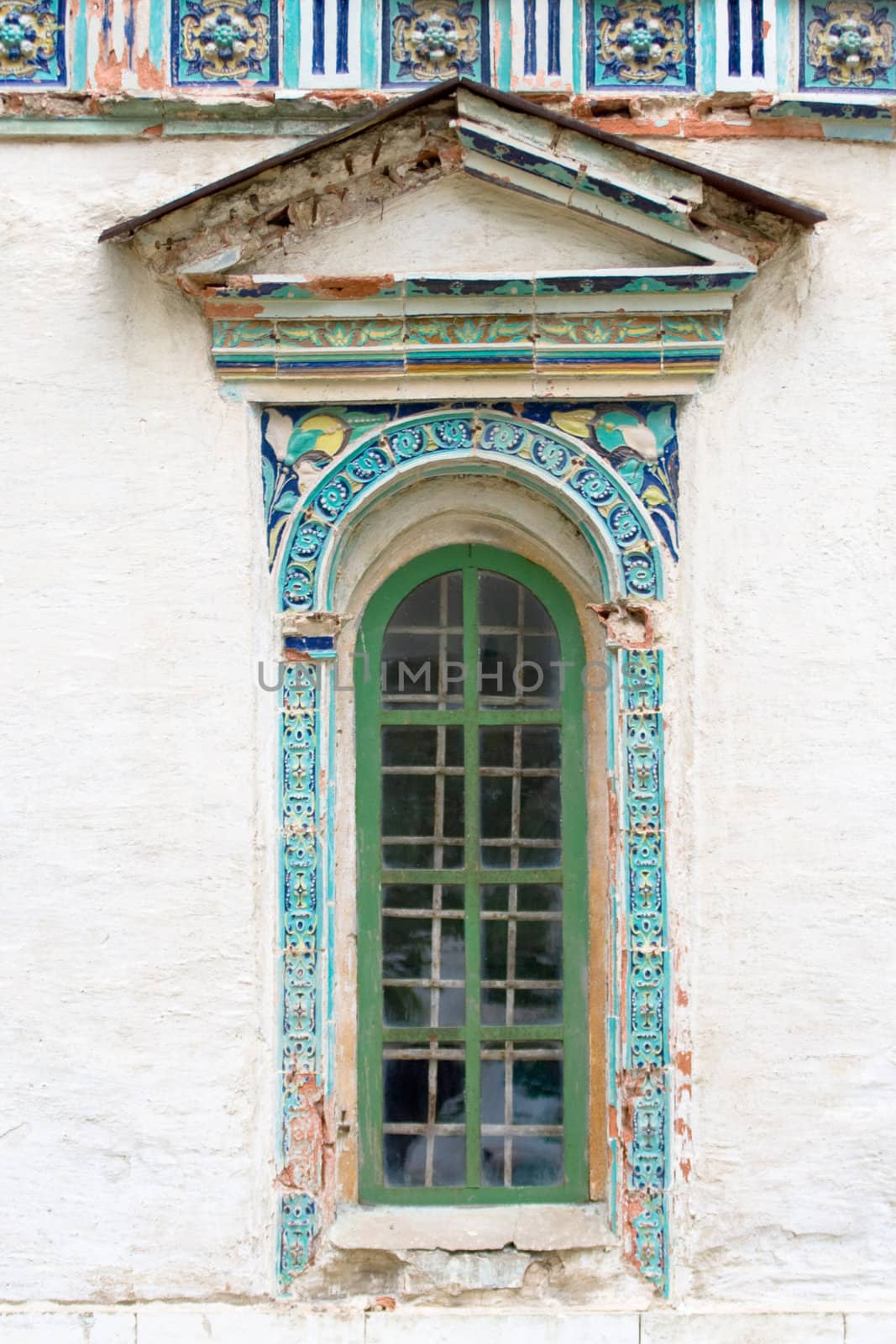 Old baroque window with flowers
