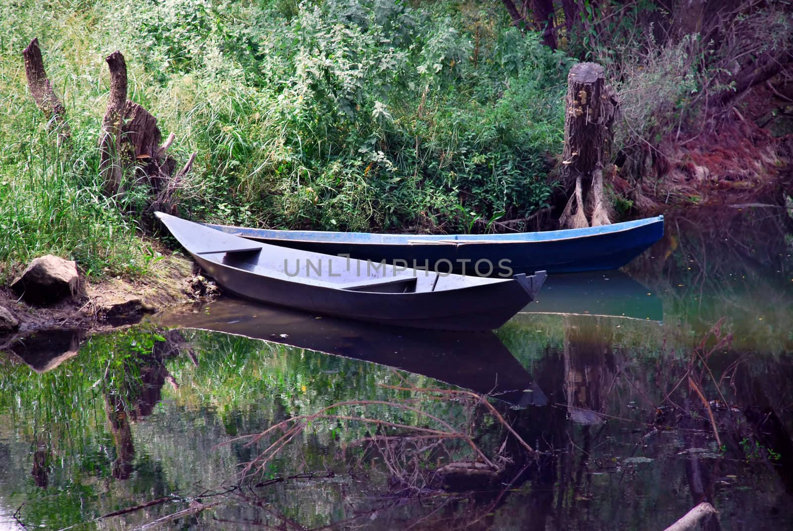two small  boats over tranquil river landscape
