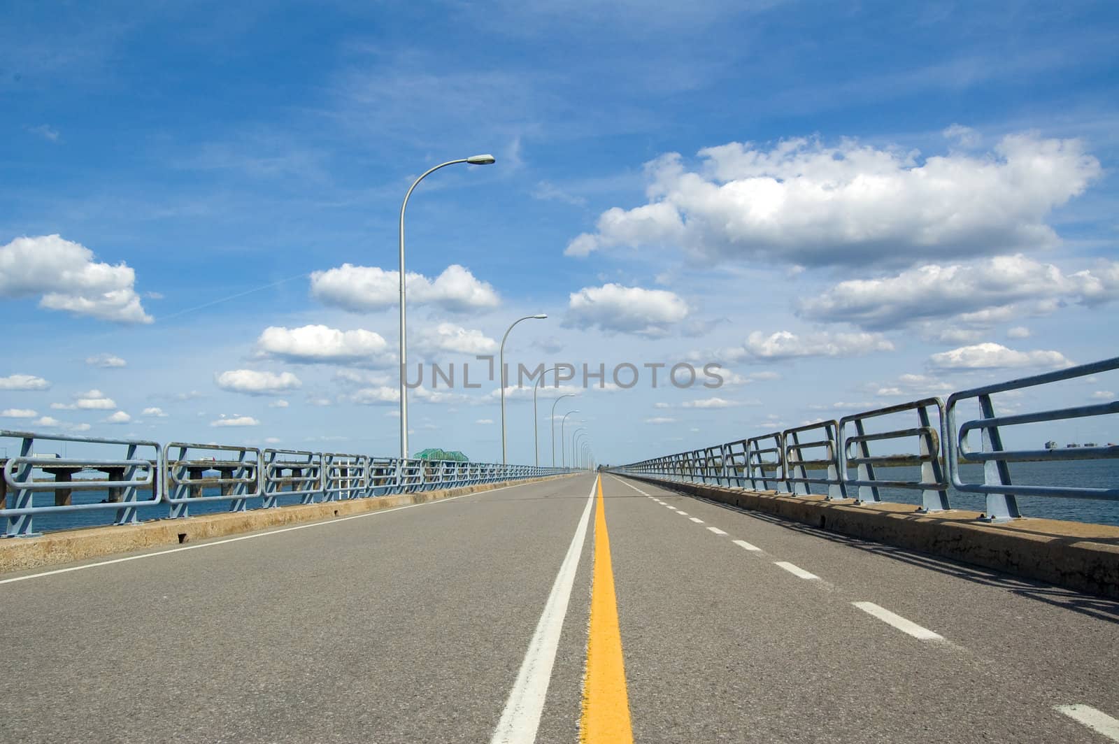 A bicycle lane on a very long bridge