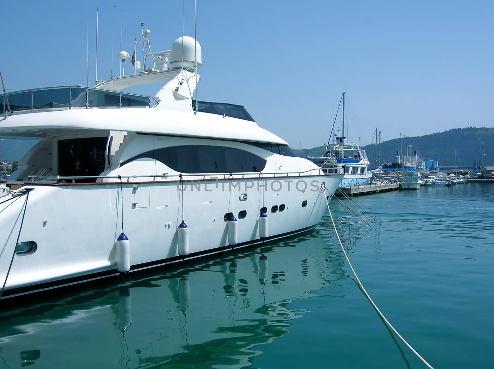 several yachts on tranquil green Adriatic sea water in Montenegro