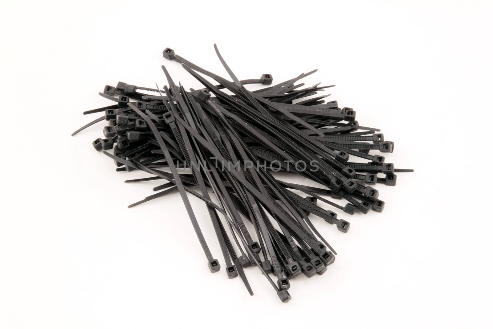 Black nylock cable ties on a white background.