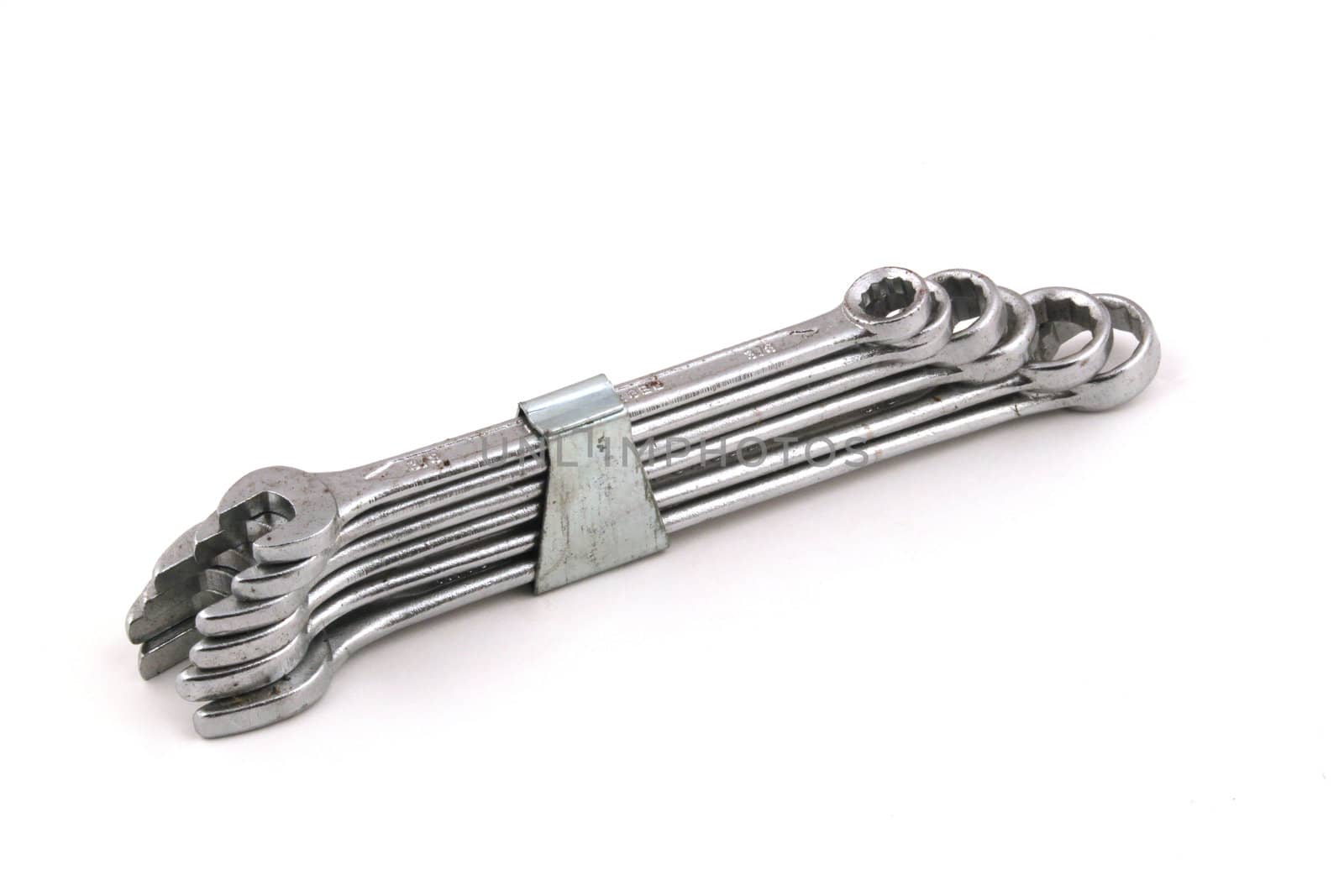 Set of chrome spanners on a white background.