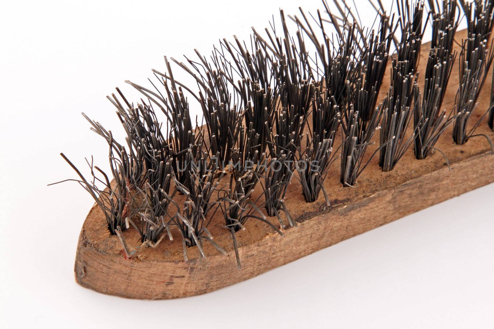 Wire brush on a plain white background