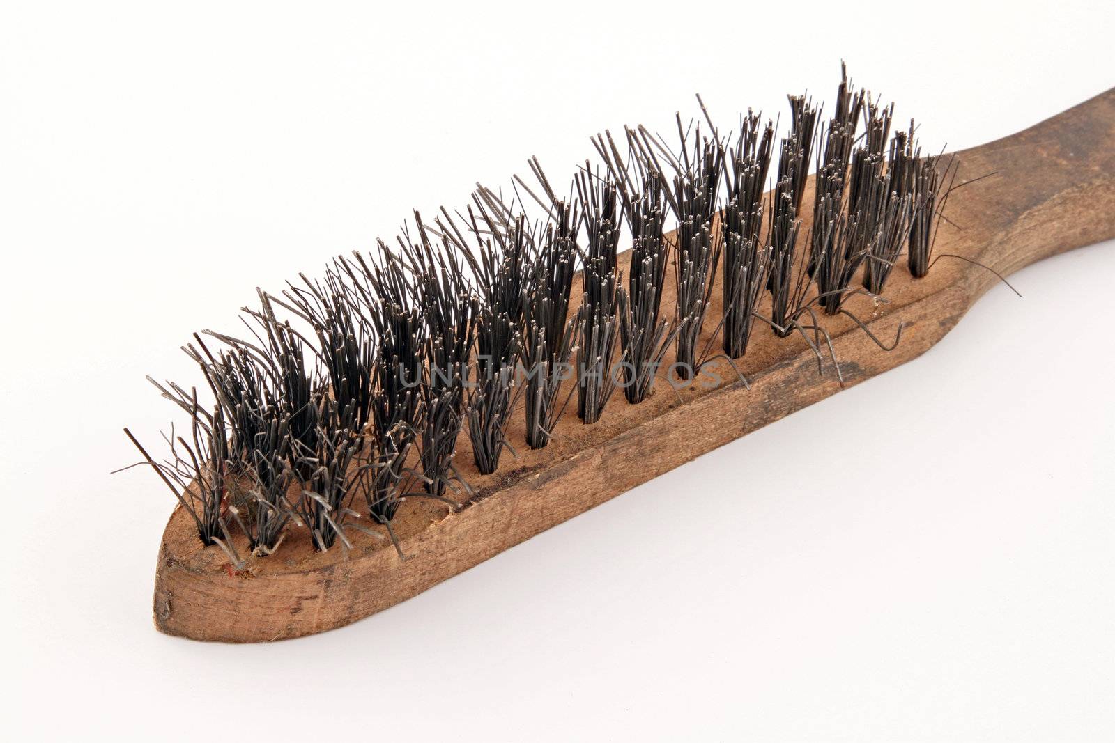 Wire brush on a plain white background