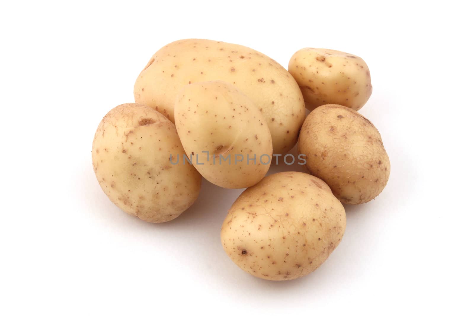 Close up of potatoes on a white background.