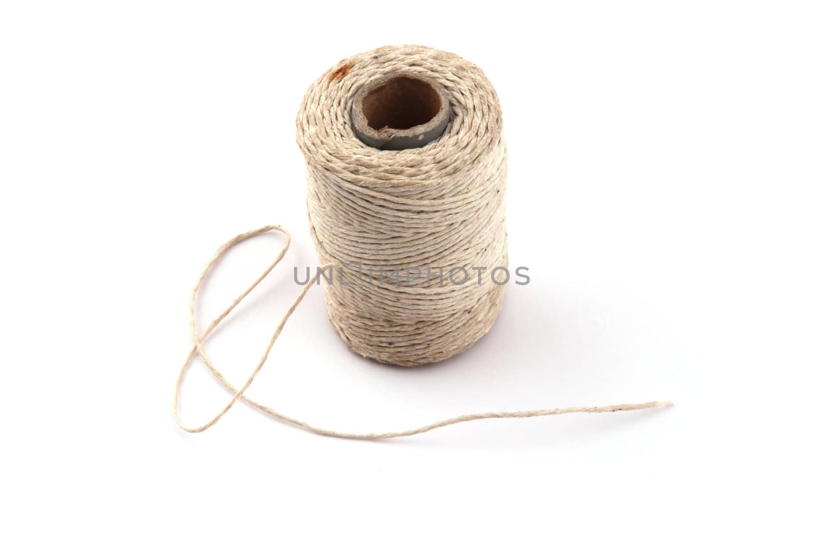 Ball of string or twine on a plain white background